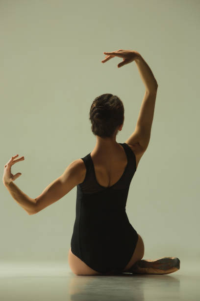 istock Young graceful female ballet dancer dancing in mixed light 1152417970