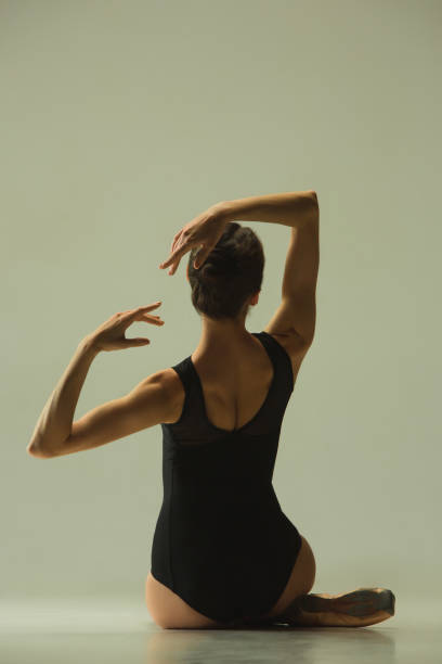 istock Young graceful female ballet dancer dancing in mixed light 1152417979