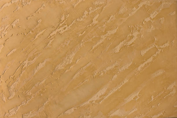 istock Photo of old gold cement wall with fractures. Texture for pattern. 1152418715