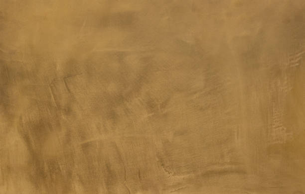 istock Photo of old gold cement wall with fractures. Texture for pattern. 1152418727
