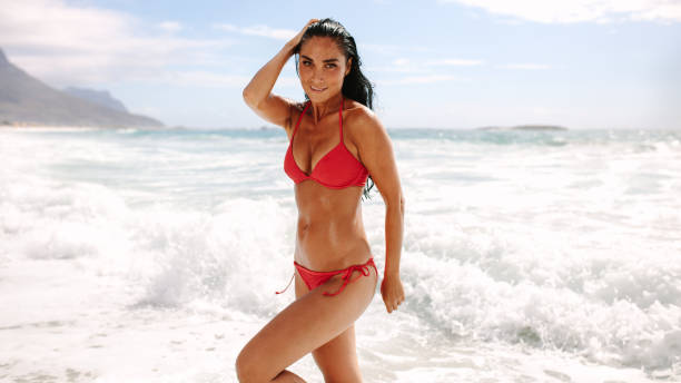 istock Beautiful woman posing in swimsuit on beach 1152420210