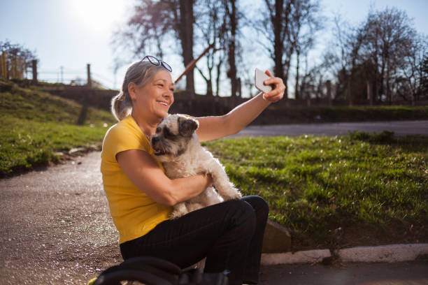 istock Senior woman taking a selfie with her dog 1152420491