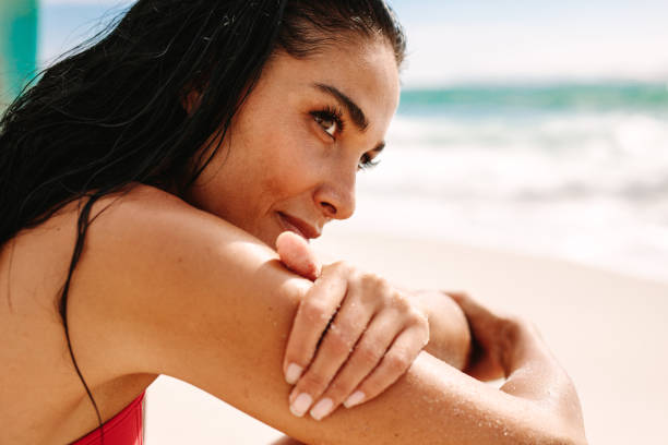 istock Woman relaxing on the sea shore 1152420673