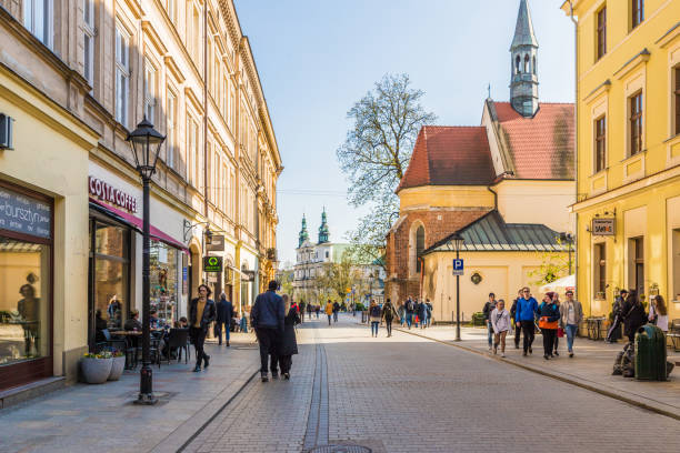 Krakow Poland. April 2019. A street scene with people in the medieval old Town in Krakow