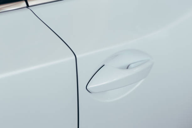 istock Closeup of white car door handle 1152422435