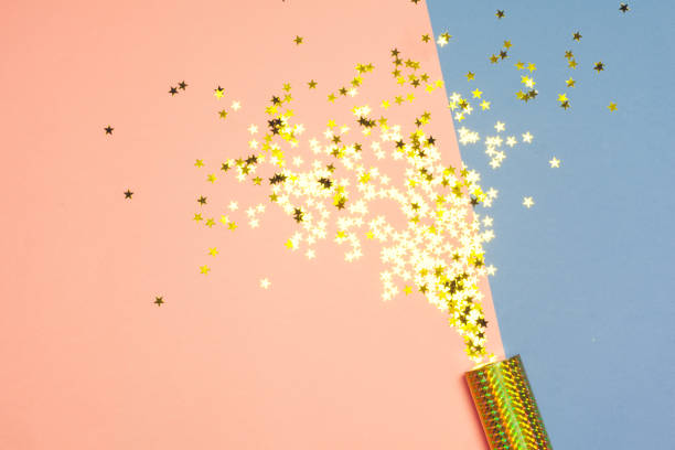 istock festive party decor and confetti on colored background 1152423666