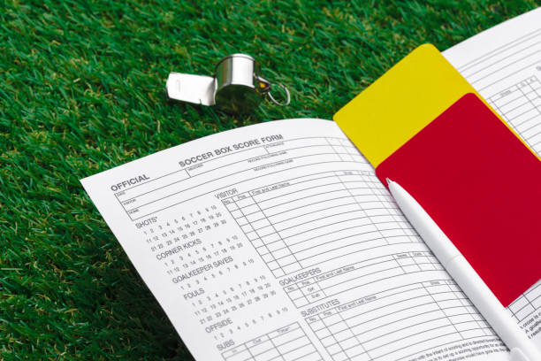 istock two penalty cards and a whistle for the referee 1152424821