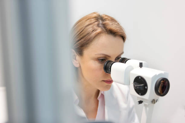 istock Woman using machinery during eye test at hospital 1152424962