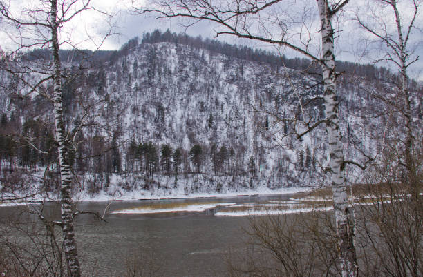 Snow covered the embankment of the river.