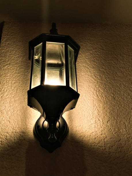 istock Old lamp Indoor lights on the wall at night. 1152425270