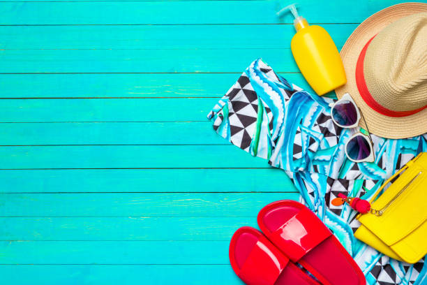 istock Composition with swimsuit on color wooden background 1152425490