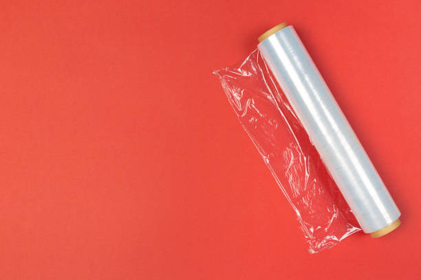Clean wrap roll on bright colored background top view Clean wrap roll on bright colored background top view polythene photos stock pictures, royalty-free photos & images