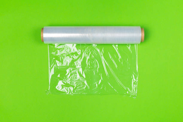 Clean wrap roll on bright colored background top view Clean wrap roll on bright colored background top view polythene photos stock pictures, royalty-free photos & images