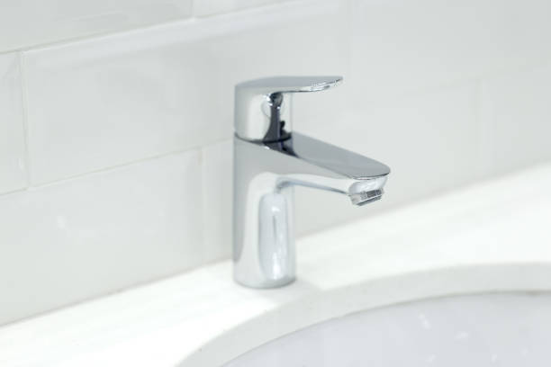istock chrome crane on the ceramic wash basin in the bathroom close up 1152428629