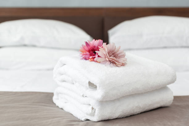 istock towels and flower on bed in hotel room 1152428652