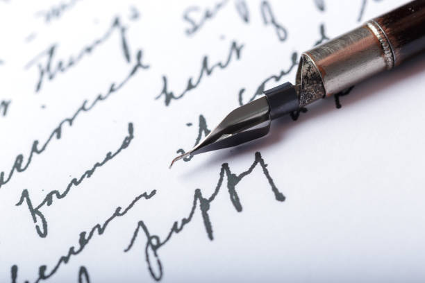 istock Fountain pen on an antique handwritten letter 1152429928