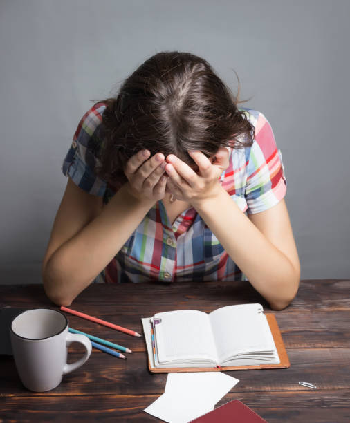 istock Young woman tired student falls asleep. Study session. Education 1152429995