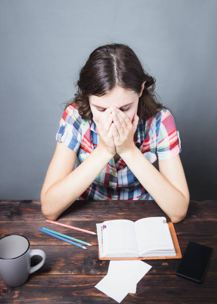 istock Young woman tired student falls asleep. Study session. Education 1152430302