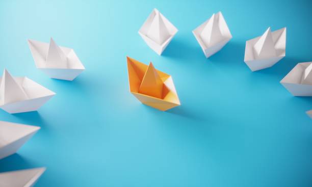 istock Leadership Concept With Paper Boats 1152430443