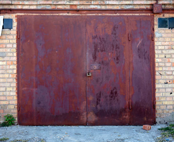 istock old metal warehouse door, hangar 1152433115