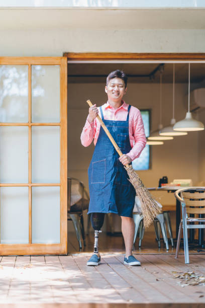 istock Amputee cafe owner getting ready to open his cafe 1152433273