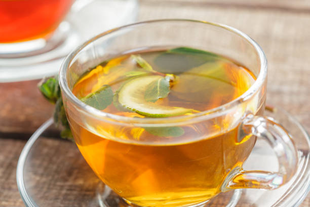 istock cup of black tea with mint leaves on a wooden table 1152433530