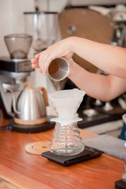 istock Barista hand pouring fresh roasted coffee 1152433574
