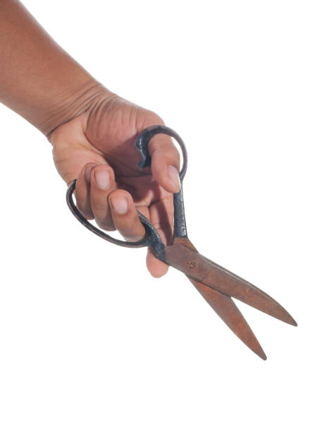 istock Hand holding of scissors rust on white backgorund 1152433866