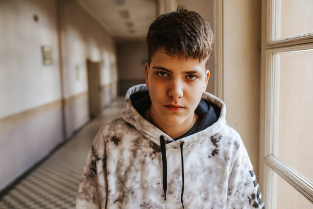 istock Young men in school looking at camera 1152436322