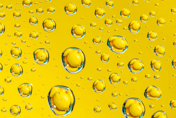 Abstract yellow background waterdrops and lemon macro picture
