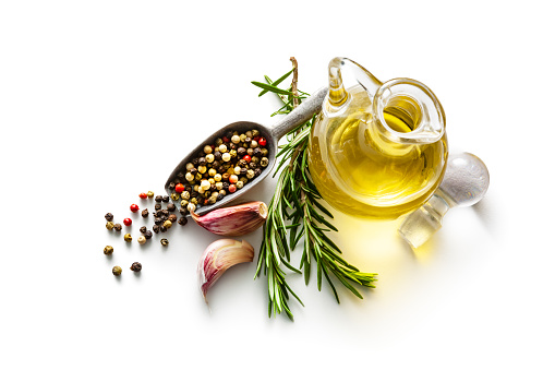 Seasoning: Olive Oil, Pepper, Rosemary and Garlic Isolated on White Background