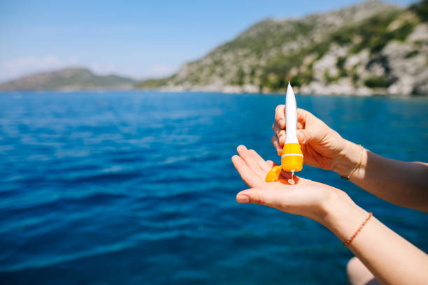 istock Woman hand apply sunscreen on the beach 1152438260