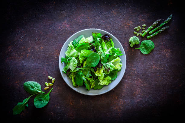 istock Vegan food: healthy fresh green salad shot from above 1152442012