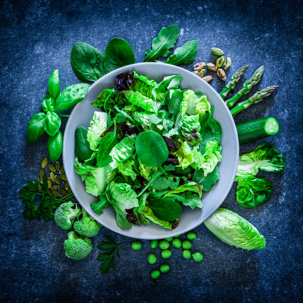 istock Vegan food: healthy fresh green salad shot from above 1152442023