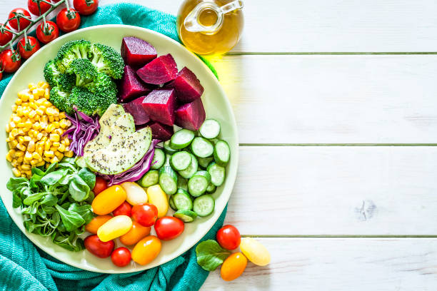 istock Healthy fresh vegetables salad shot from above with copy space 1152442130