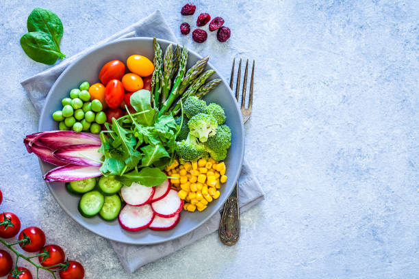 istock Healthy fresh vegetables salad shot from above with copy space 1152443220