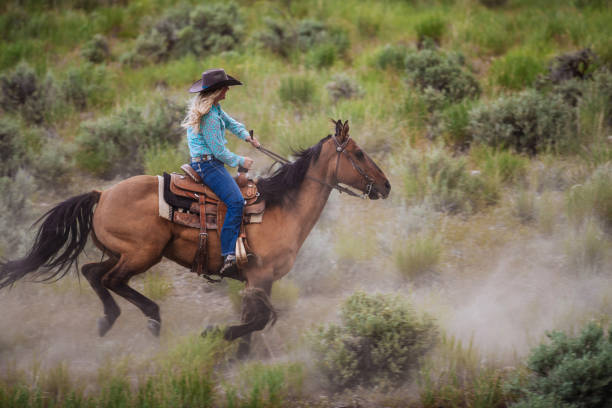 istock Cowgirl Horseback Riding 1152444239