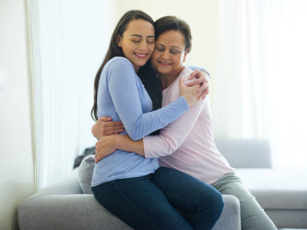 istock Loving daughter hugging mother with tenderness 1152444599
