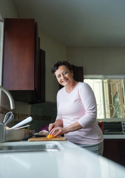 istock Latin mature woman in the kitchen 1152444644