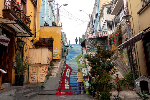 Valparaiso, Chile â April 3, 2019: Colorful decorated houses and steps in the UNESCO World Heritage port city of Valparaiso in Chile