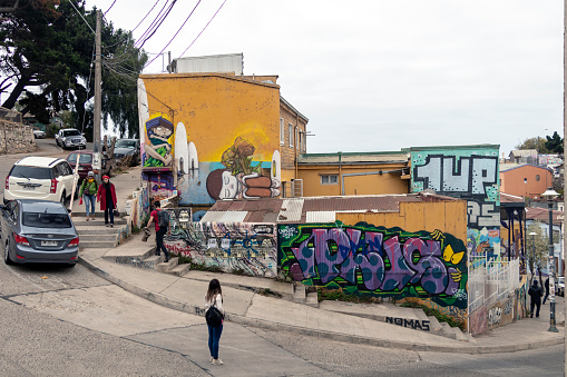 Valparaiso, Chile â April 3, 2019: Colorful decorated houses and steps in the UNESCO World Heritage port city of Valparaiso in Chile