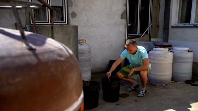 Man making moonshine schnapps