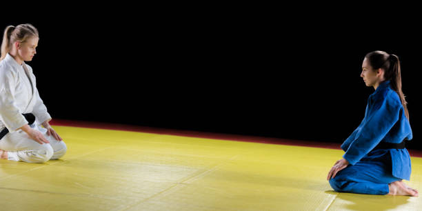 istock Judo Players Kneeling On Mat 1152446385