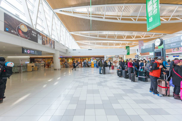 crowed of tourists at departure hall of the new shin chitose airport in hokkaido,japan - new chitose imagens e fotografias de stock