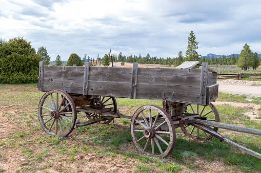 This old time wagon is set in a horse pasture near the highway that runs in front of Bryce Canyon National Park in Utah.