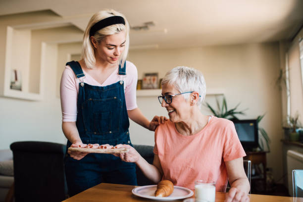 istock Girl serving breakfast for her mother 1152447542