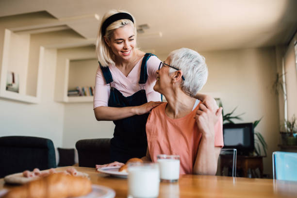 istock Mother and daughter hugging during breakfast 1152447558