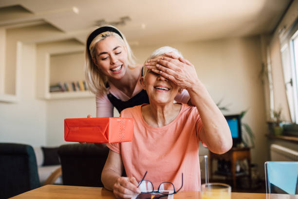 istock Woman giving her mother a gift 1152449613