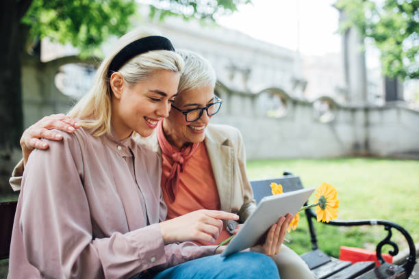 istock Women using digital tablet in the park 1152449940