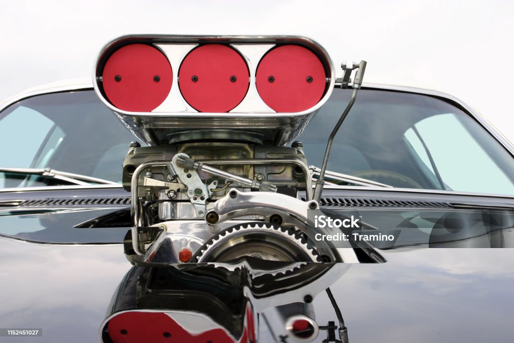 Blower on the mask of classic muscle car Shot on the blower on the mask of classic muscle car. Engine Stock Photo